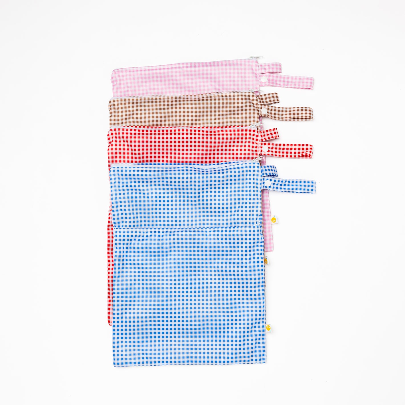Set of colorful checkered bags on a white background