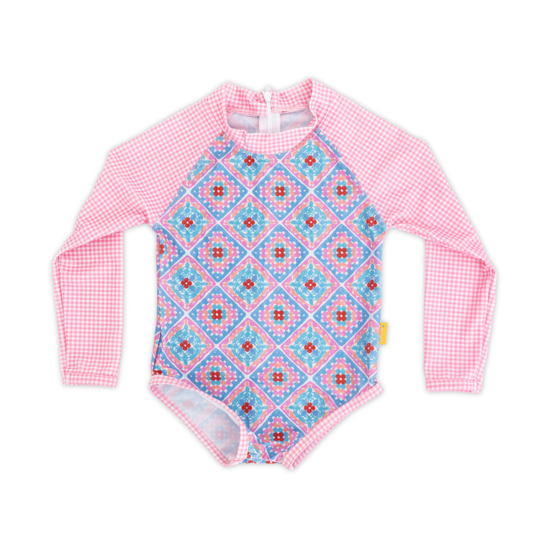 Girls long sleeve one-piece swimsuit in Petal Patchwork crochet print with pink gingham raglan sleeves and collar, full-body UPF 50+ sun protection, eco-friendly recycled polyester swimwear.