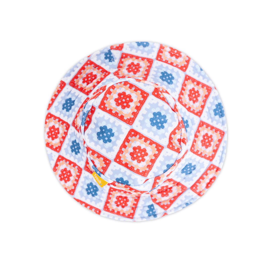 Tyoub kids’ wide brim bucket hat in Modern Retro Granny Square print, top view showing colourful crochet diamond pattern, made from recycled polyester swim fabric with UPF 50+ sun protection.