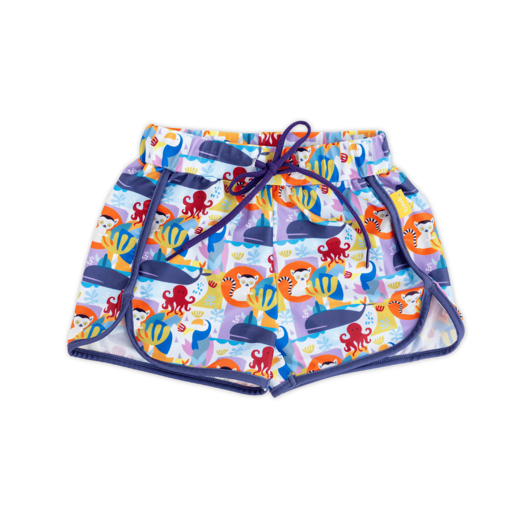Unisex kids’ mid-length swim trunks in Animal Spirit print featuring lemur, toucan, whale and octopus, eco-friendly recycled polyester fabric, wide elastic waistband with drawcord for secure fit, quick-dry UPF 50+ swimwear.